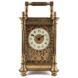 An early 20th century French gilt brass carriage timepiece 9cm wide 13cm high