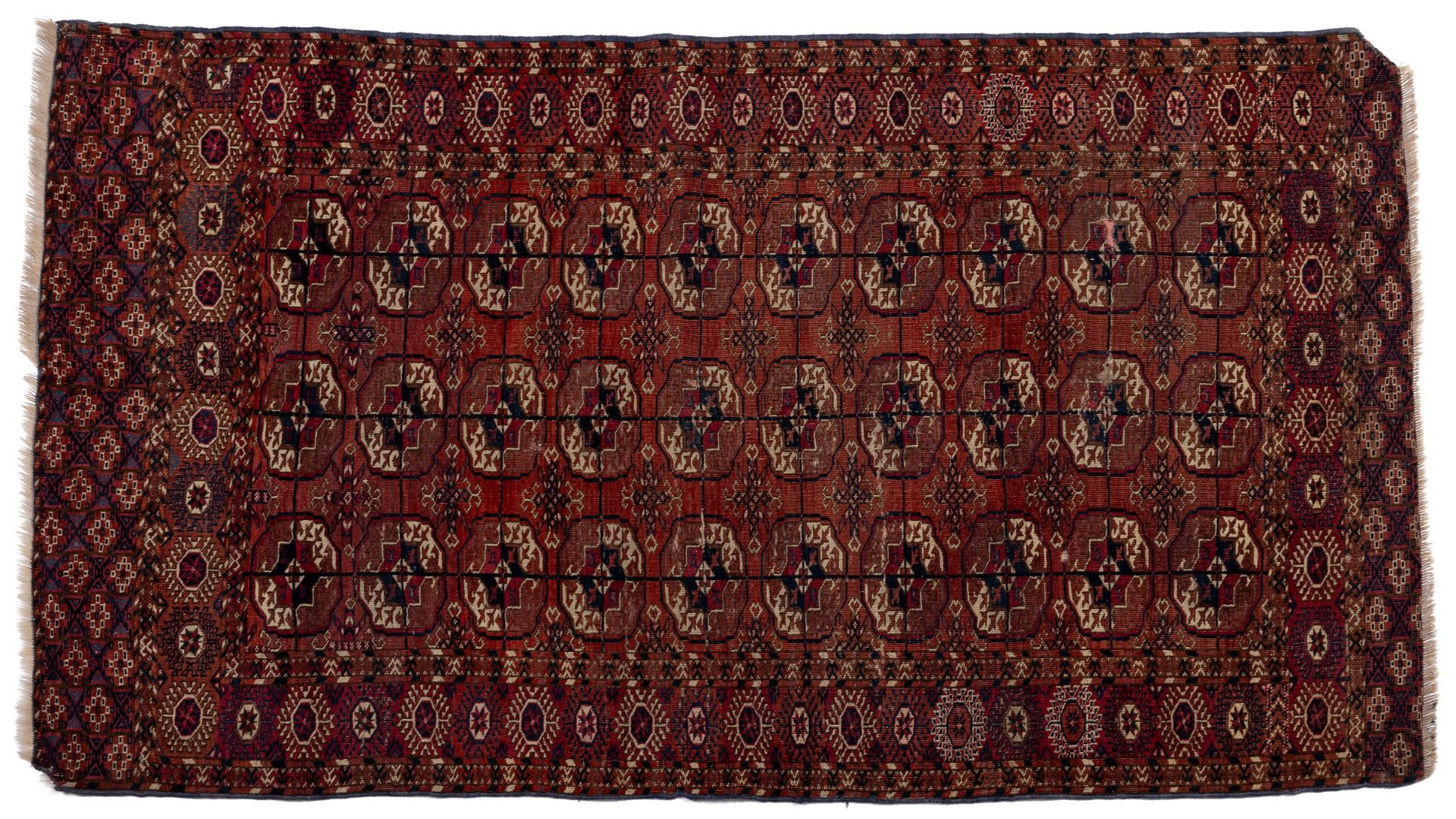 A mid 19th century Tekke Turkoman rug with three rows of guls 107cm x 190cm