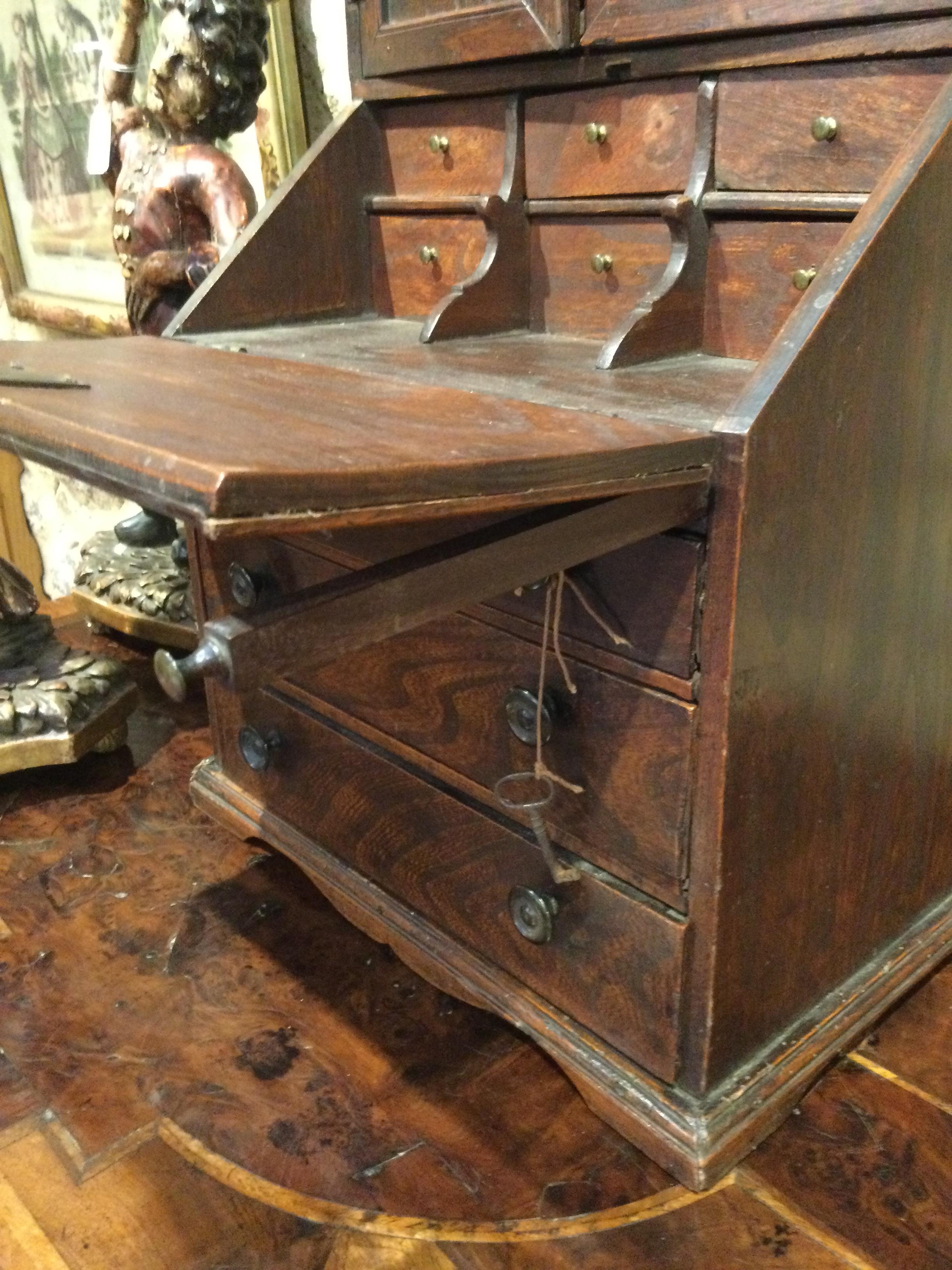 An 18th century elm apprentice bureau bookcase with panelled doors above a fall front three - Image 22 of 26