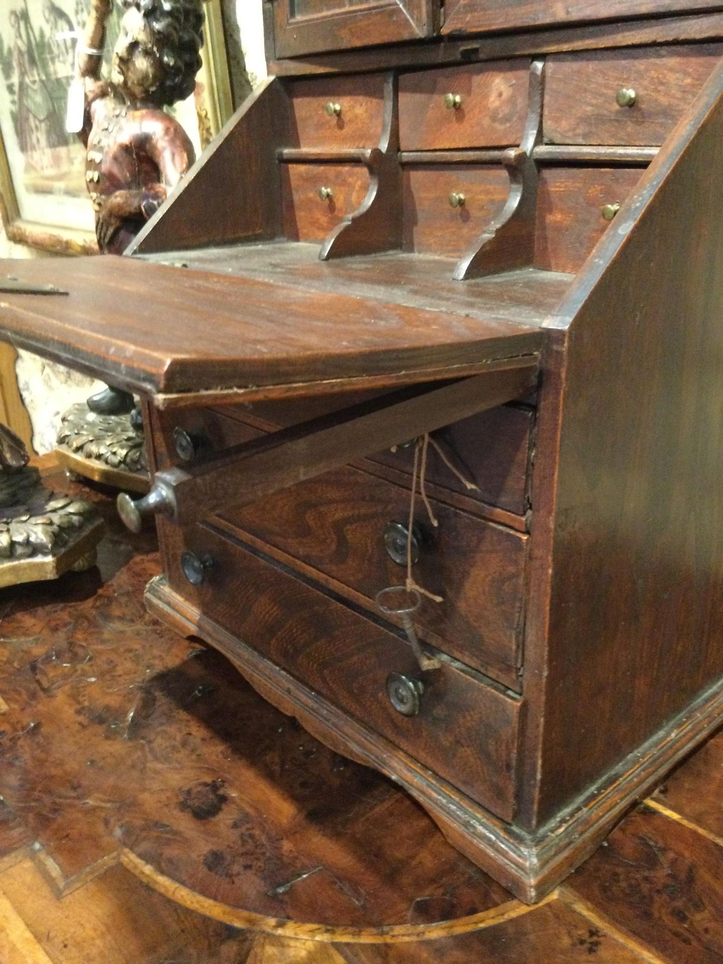 An 18th century elm apprentice bureau bookcase with panelled doors above a fall front three - Image 22 of 26