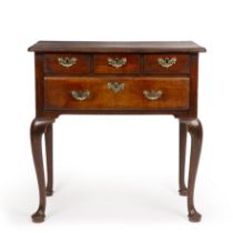 A George III mahogany low boy with four drawers having brass handles and cabriole legs 76cm wide