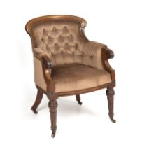 An early Victorian mahogany framed upholstered library armchair with turned and fluted legs 62cm