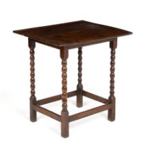 A Queen Anne oak table, with turned supports united by stretchers circa 1710, 61cm wide 41cm deep