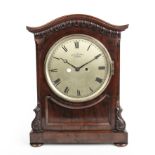 An early 19th century bracket clock by George Sharp having a silvered dial with Roman numerals and a