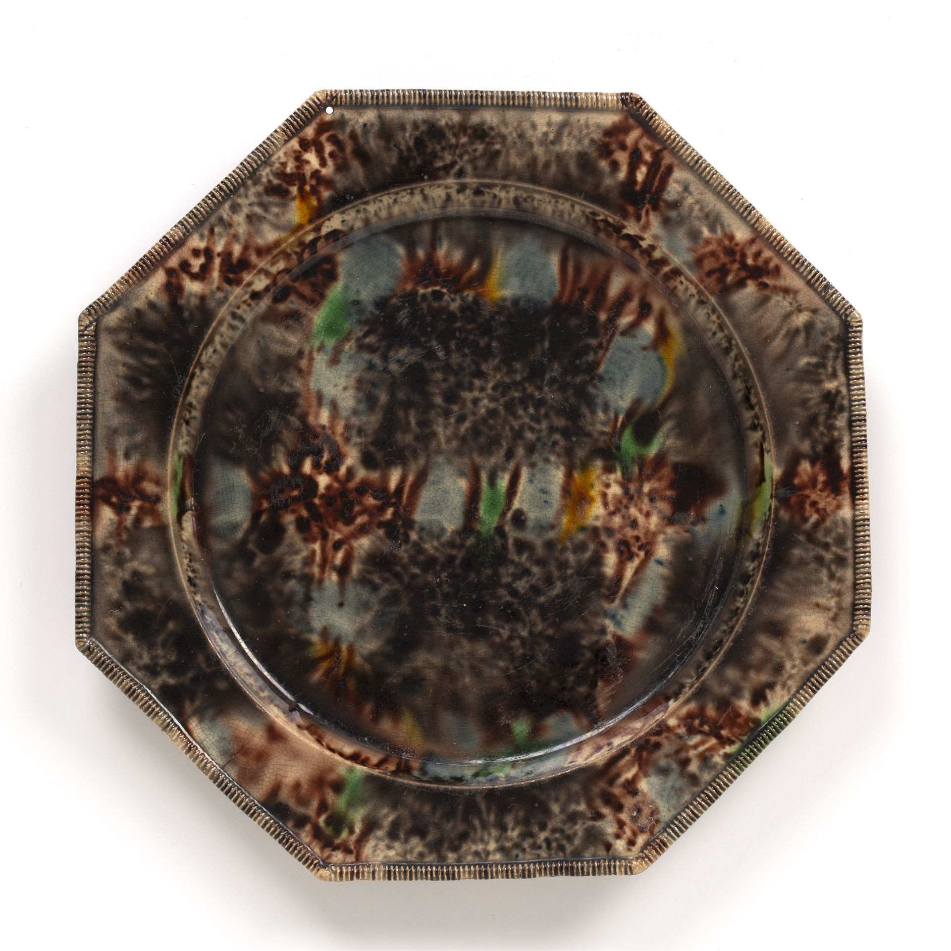 An 18th century Whieldon pottery plate of octagonal form circa 1760-70, 21.5cm wide small dripped