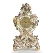 A 19th century porcelain mantel timepiece, the engine turned gilt dial with blue enamel Roman