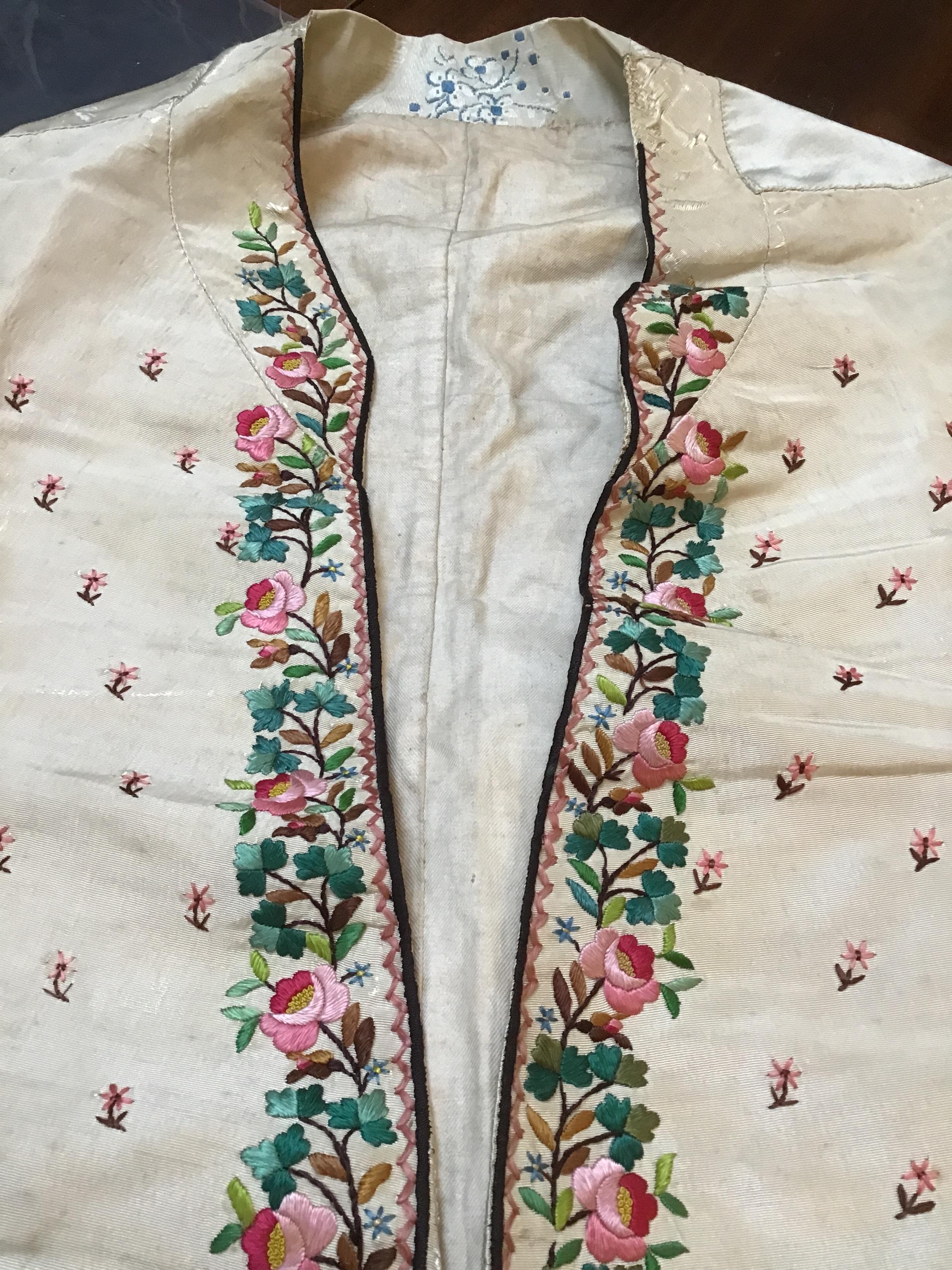 A Georgian silk embroidered waistcoat, decorated with flowers. Stains, marks.  Fraying around button - Image 20 of 24