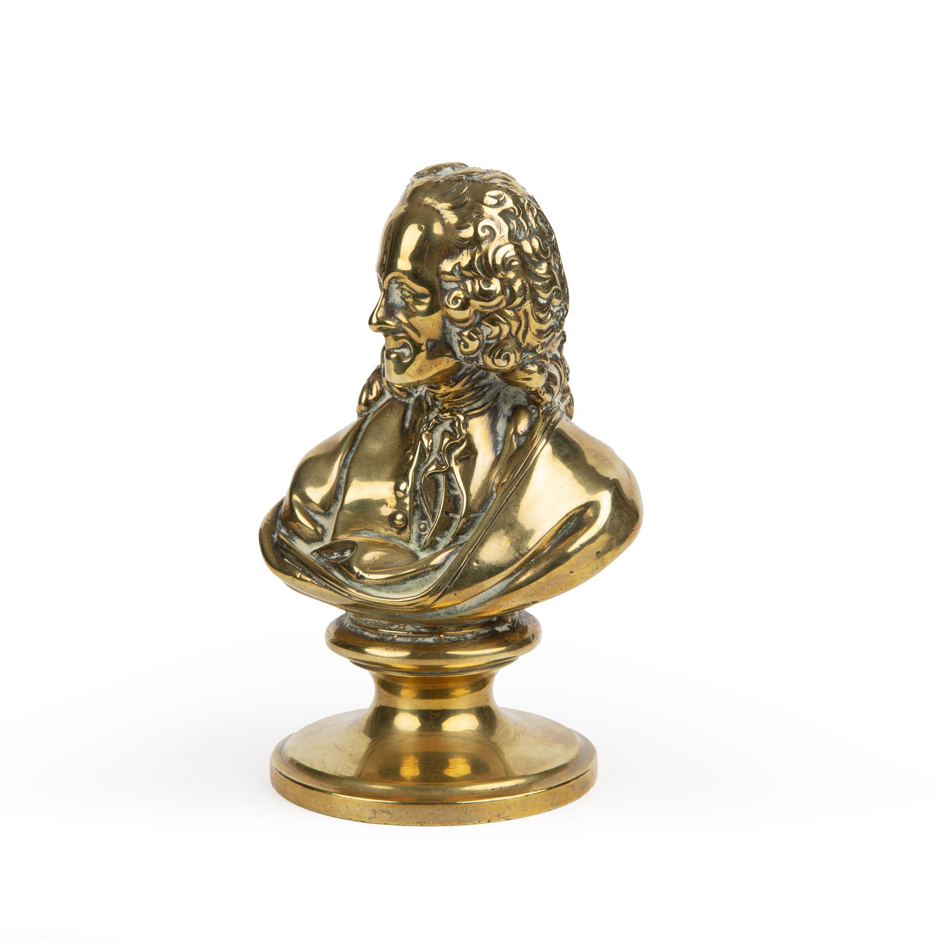 A late 19th century gilt metal head and shoulder bust of a gentleman 10cm wide 15cm high.