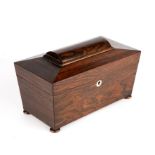 A Regency rosewood tea caddy of sarcophagus form with turned bun feet, 30cm wide 16cm deep 18cm high