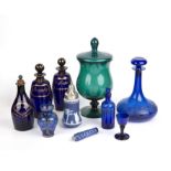 Three Bristol blue glass decanters the largest 22cm high, a blue glass ships decanter, and a