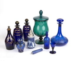 Three Bristol blue glass decanters the largest 22cm high, a blue glass ships decanter, and a
