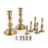 19th century brassware to include candlesticks, tapersticks and small Dickens figures