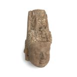 An ancient Indian sandstone head of a Deity 9cm wide 19cm high Provenance A private estate since the