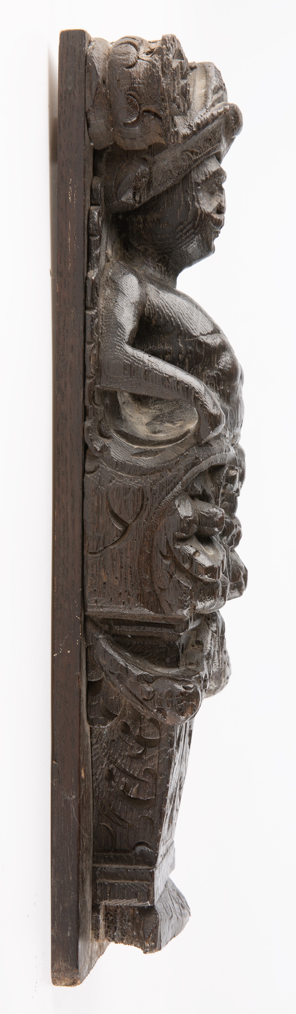 An early 17th century carved oak caryatid term 40cm x 12cm Chips, marks and small losses. - Image 3 of 4