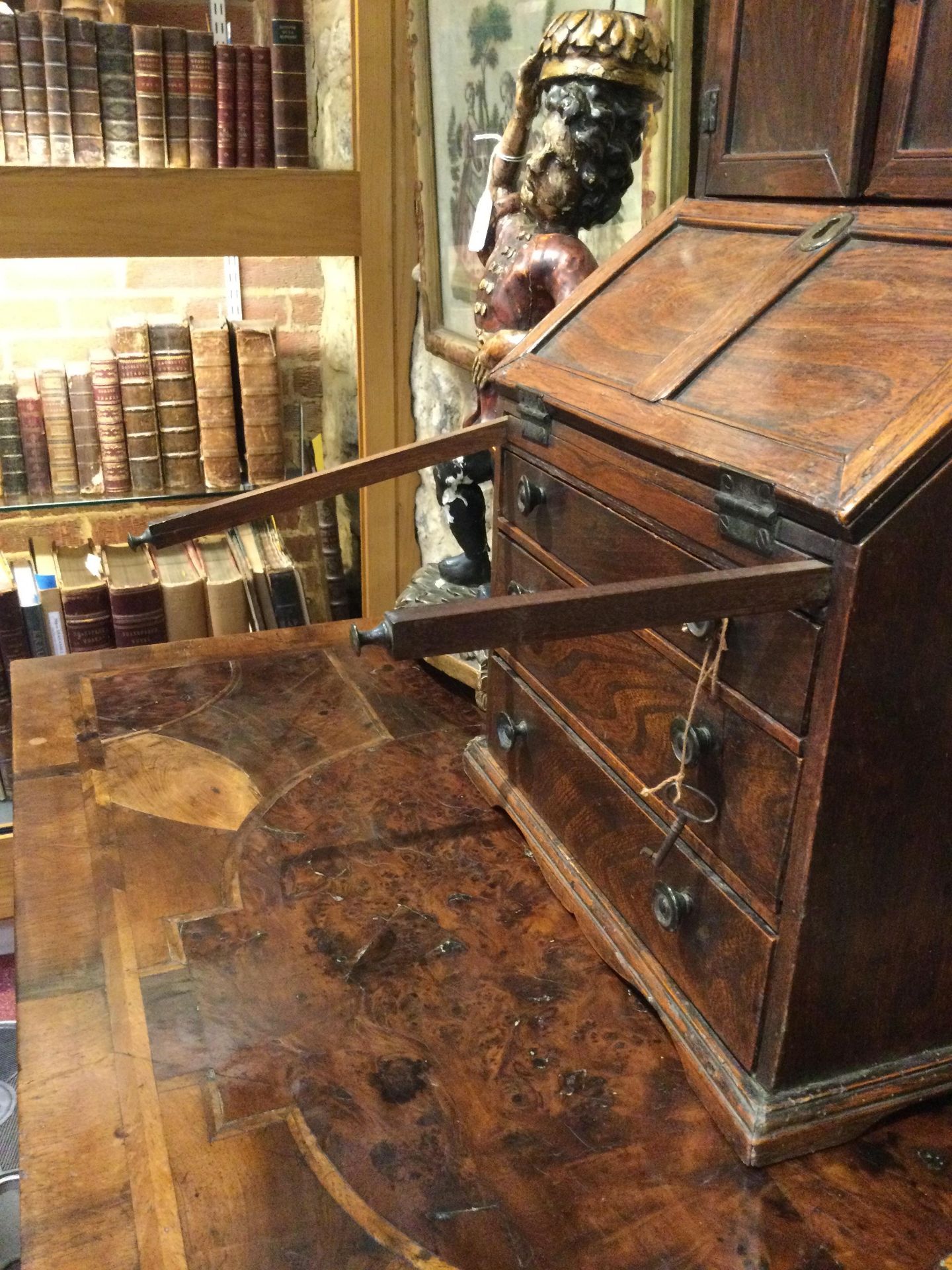 An 18th century elm apprentice bureau bookcase with panelled doors above a fall front three - Image 7 of 26