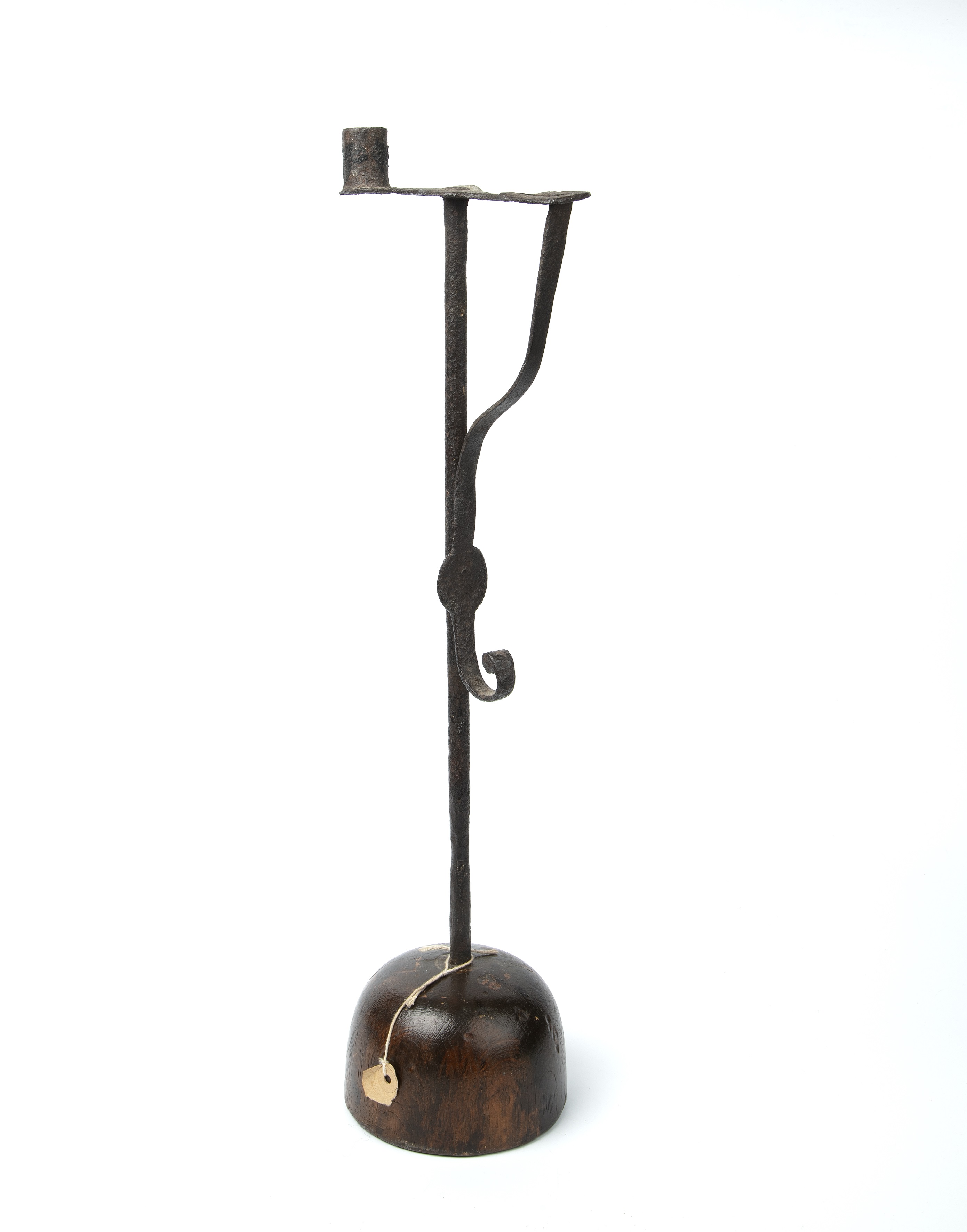 An 18th century wrought iron rush light with a turned oak base 16cm wide 54cm high.