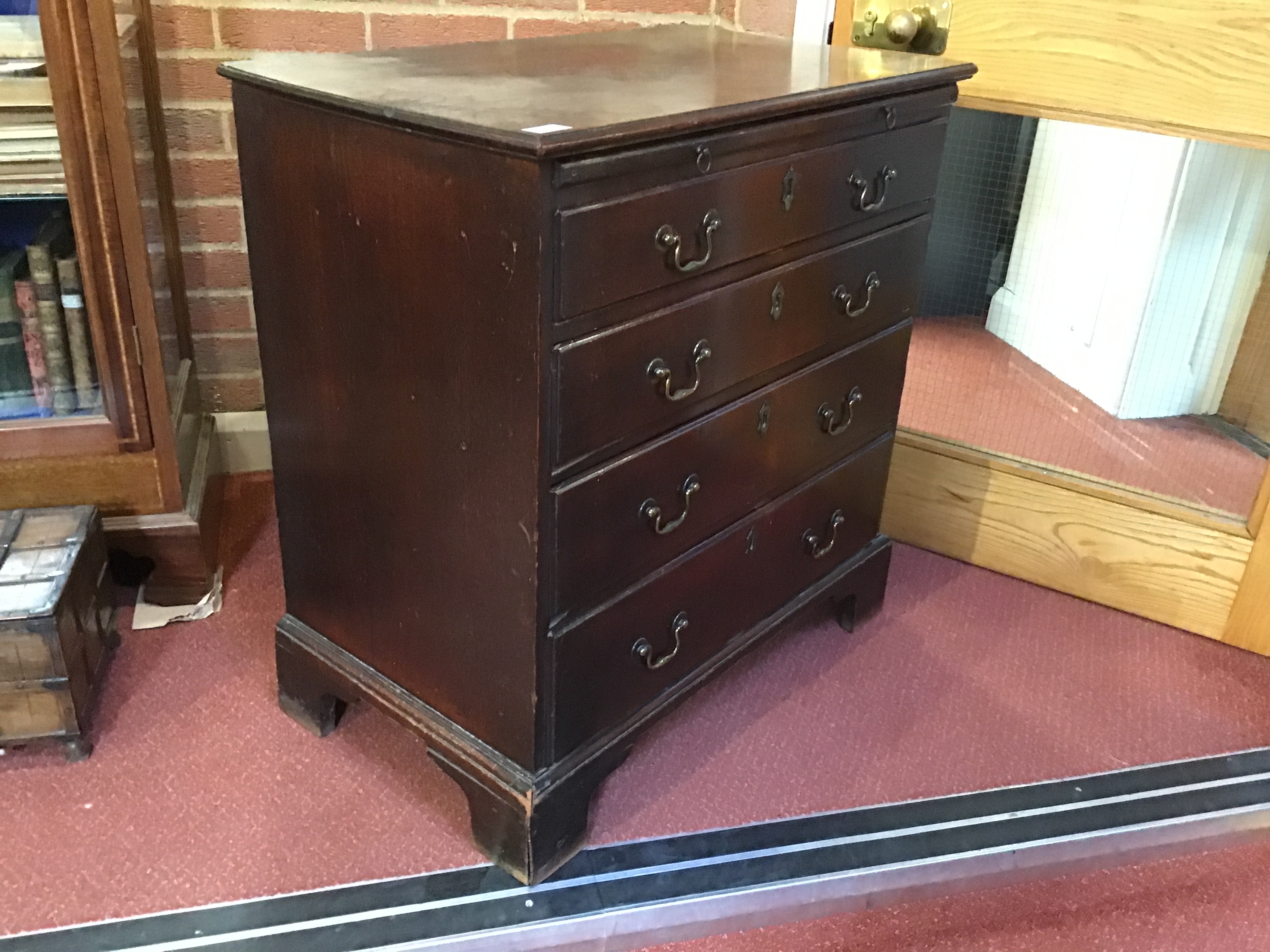 A George III mahogany chest of four long drawers having brass swan neck handles, a brushing slide - Image 20 of 31