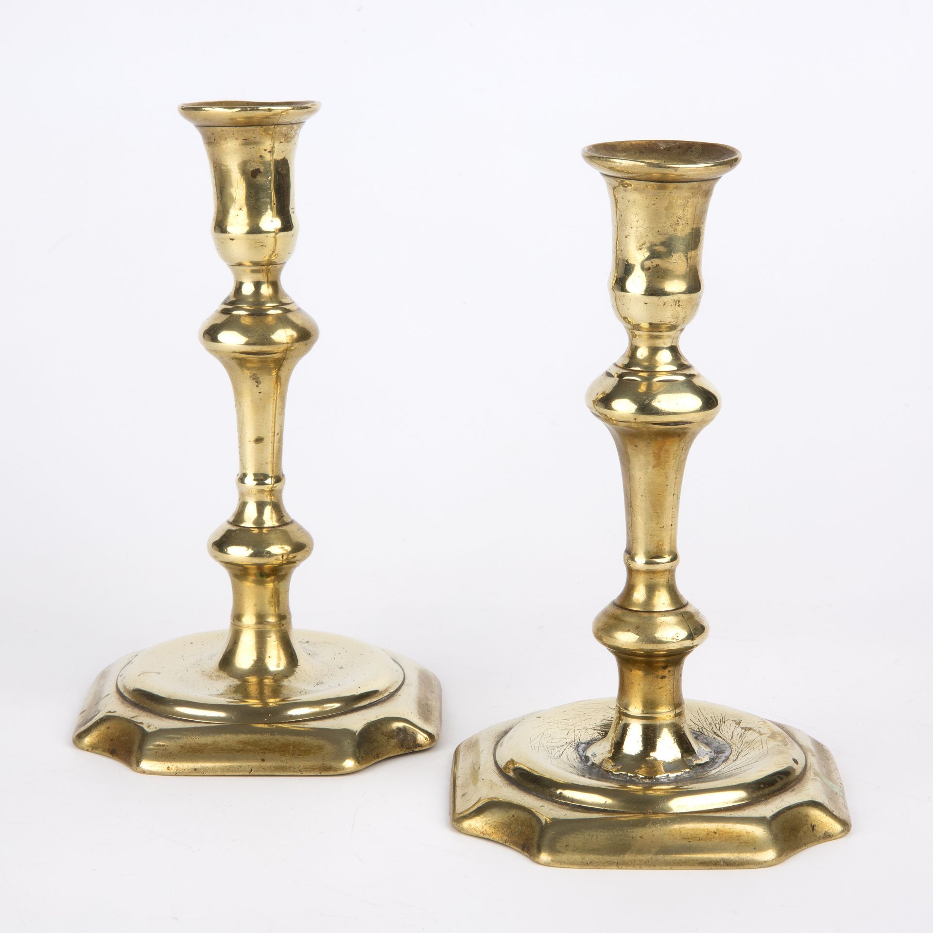 A pair of George II brass candlesticks circa 1740, 10cm wide 18cm high Restoration to one. - Image 2 of 3