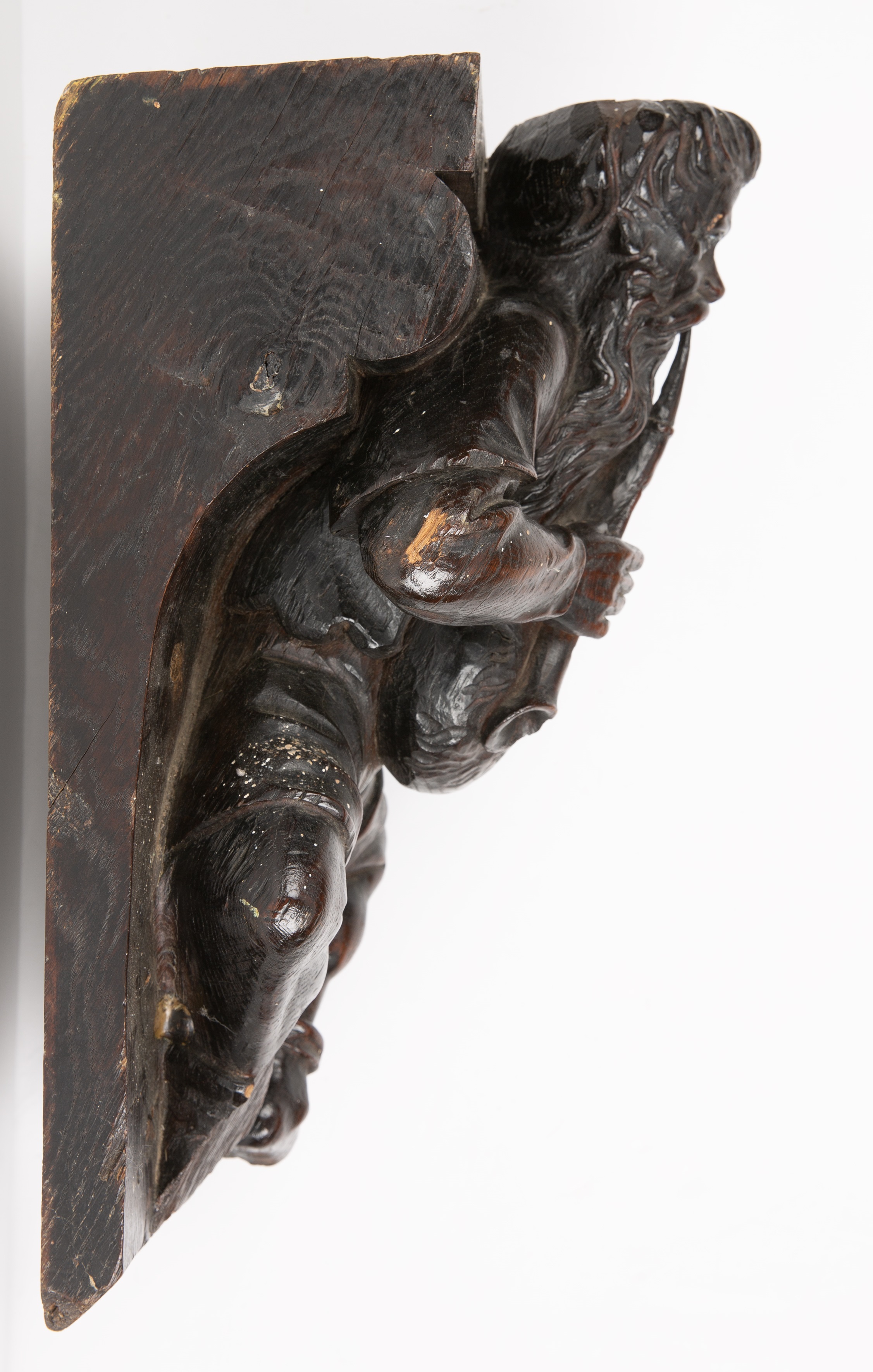 An 18th/19th century carved oak bracket in the form of a medieval bag piper 23cm wide 26vcm deep - Image 2 of 3