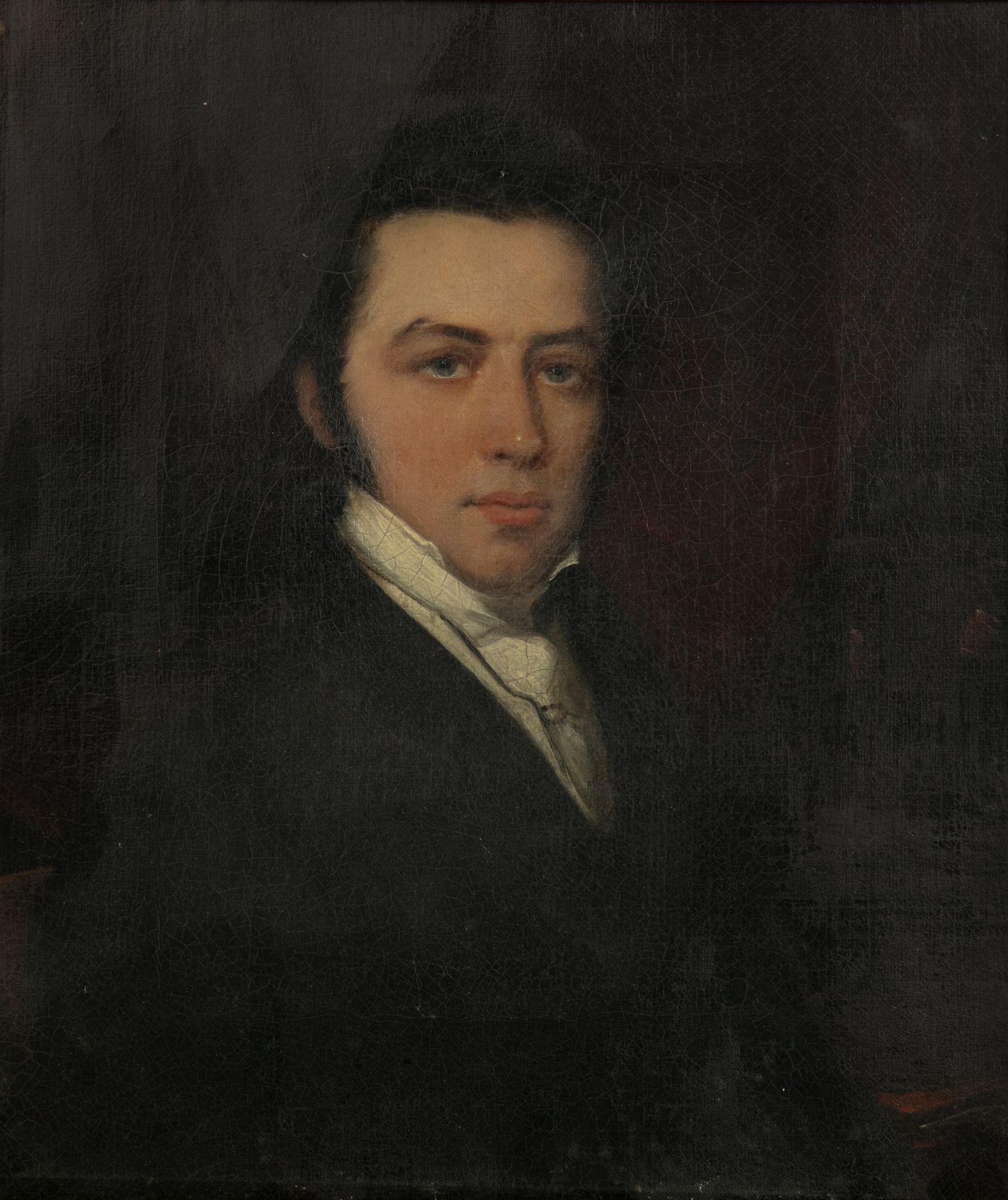 A 19th century head and shoulder portrait of a gentleman, oil on canvas 24cm x 20cm, mounted in a