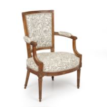 A Louis XVI style upholstered open armchair with scrolled arms and tapered fluted legs,59cm wide