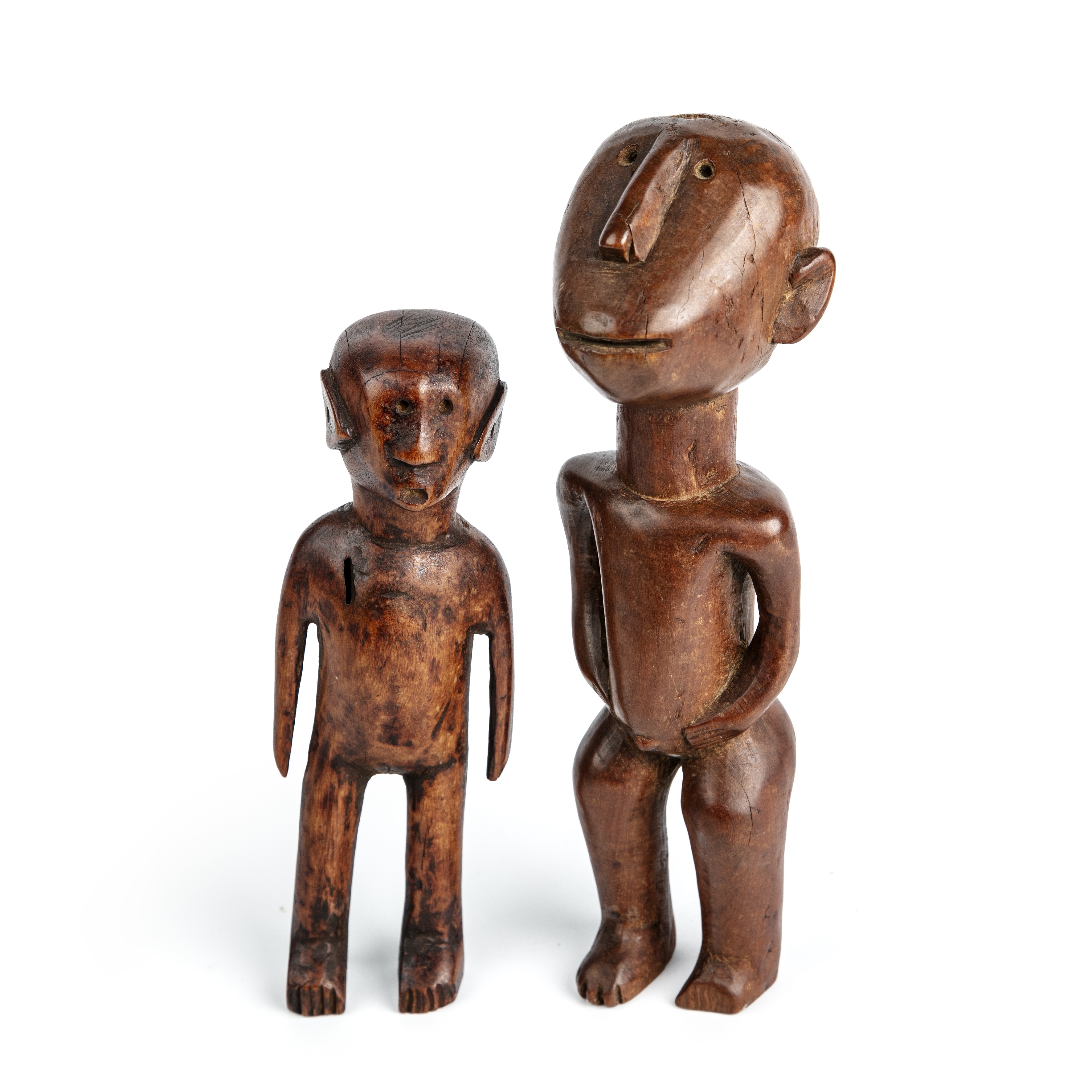 Two antique carved hardwood South African figures the largest 24cm high.