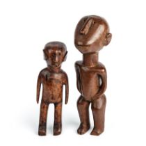 Two antique carved hardwood South African figures the largest 24cm high.