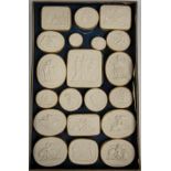 A large collection of Grand Tour plaster relief plaques approximately 400 in wooden trays.