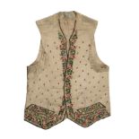 A Georgian silk embroidered waistcoat, decorated with flowers. Stains, marks.  Fraying around button