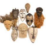 A Pende Congo mask, 17cm x 36cm, a Congo mask, two Fang masks, a Lega passport mask and four further