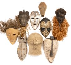 A Pende Congo mask, 17cm x 36cm, a Congo mask, two Fang masks, a Lega passport mask and four further