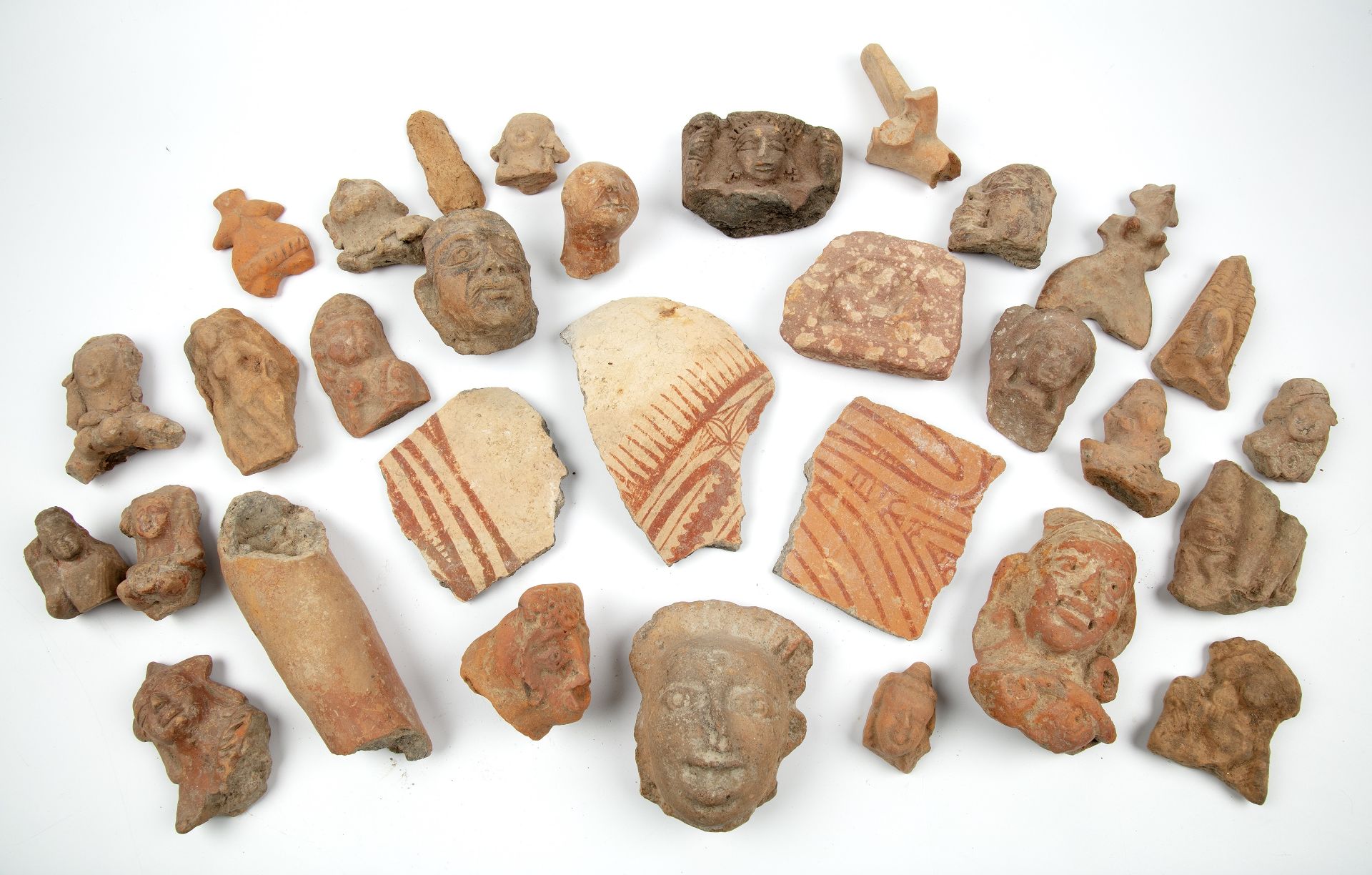 A collection of ancient Indian terracotta figures and fragments to include Ban Chaing Thailand