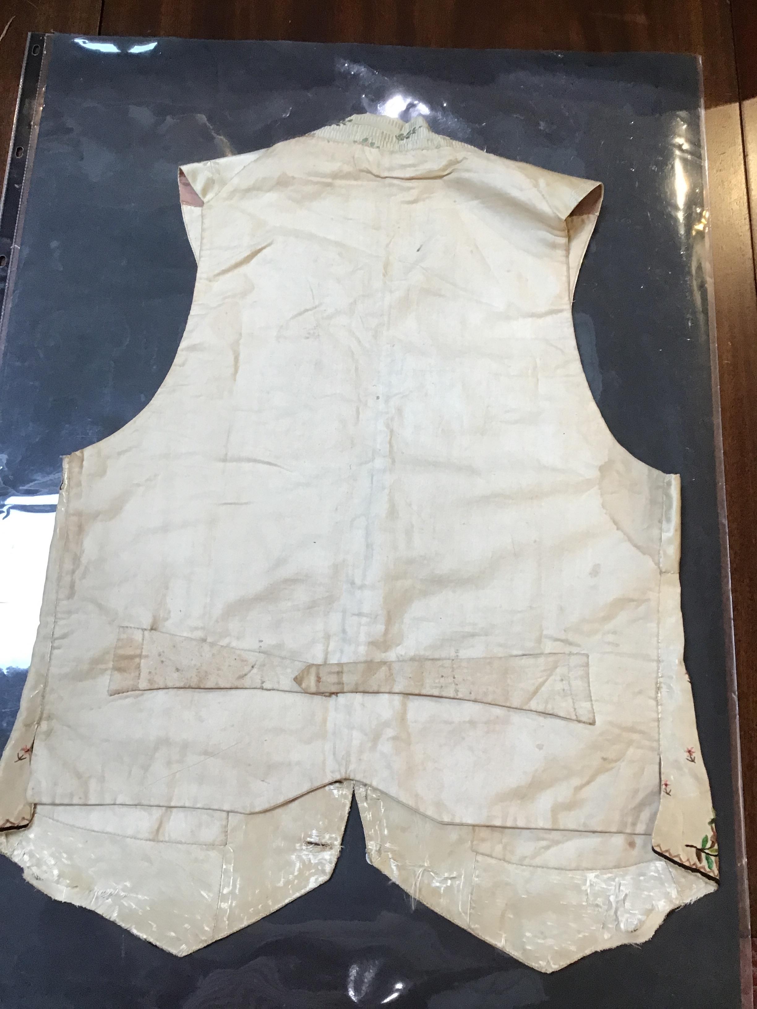 A Georgian silk embroidered waistcoat, decorated with flowers. Stains, marks.  Fraying around button - Image 8 of 24