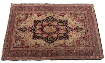 An early 20th century Isfahan rug with geometric foliate decoration, 127cm x 204cm boarder worn,