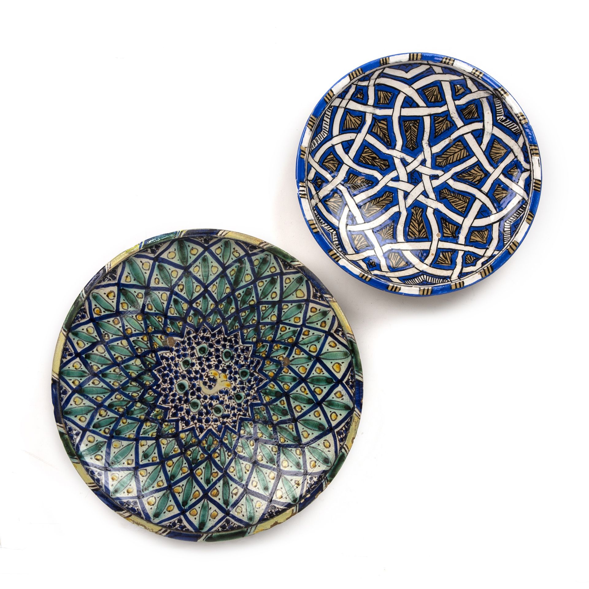 Two late 19th/ early 20th century Moroccan faience chargers the largest 34.5cm diameter small