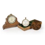 A Negretti & Zambra travellers forecasting aneroid barometer and weather forecaster, each housed