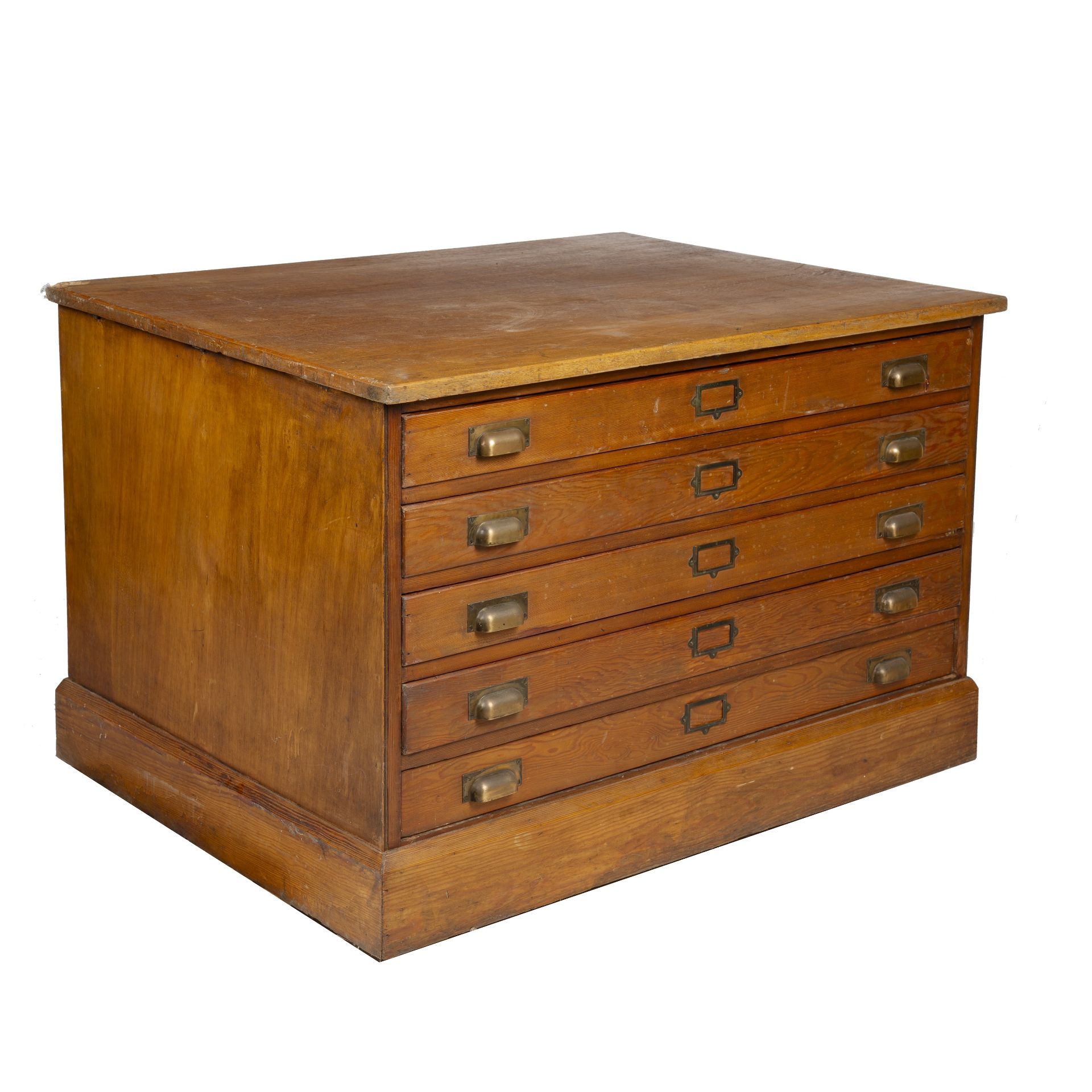 An early 20th century oak and pine five drawer plan chest, with cup handles and a plinth base, 120cm