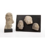 Four pre Columbian pottery heads 6cm x 5cm