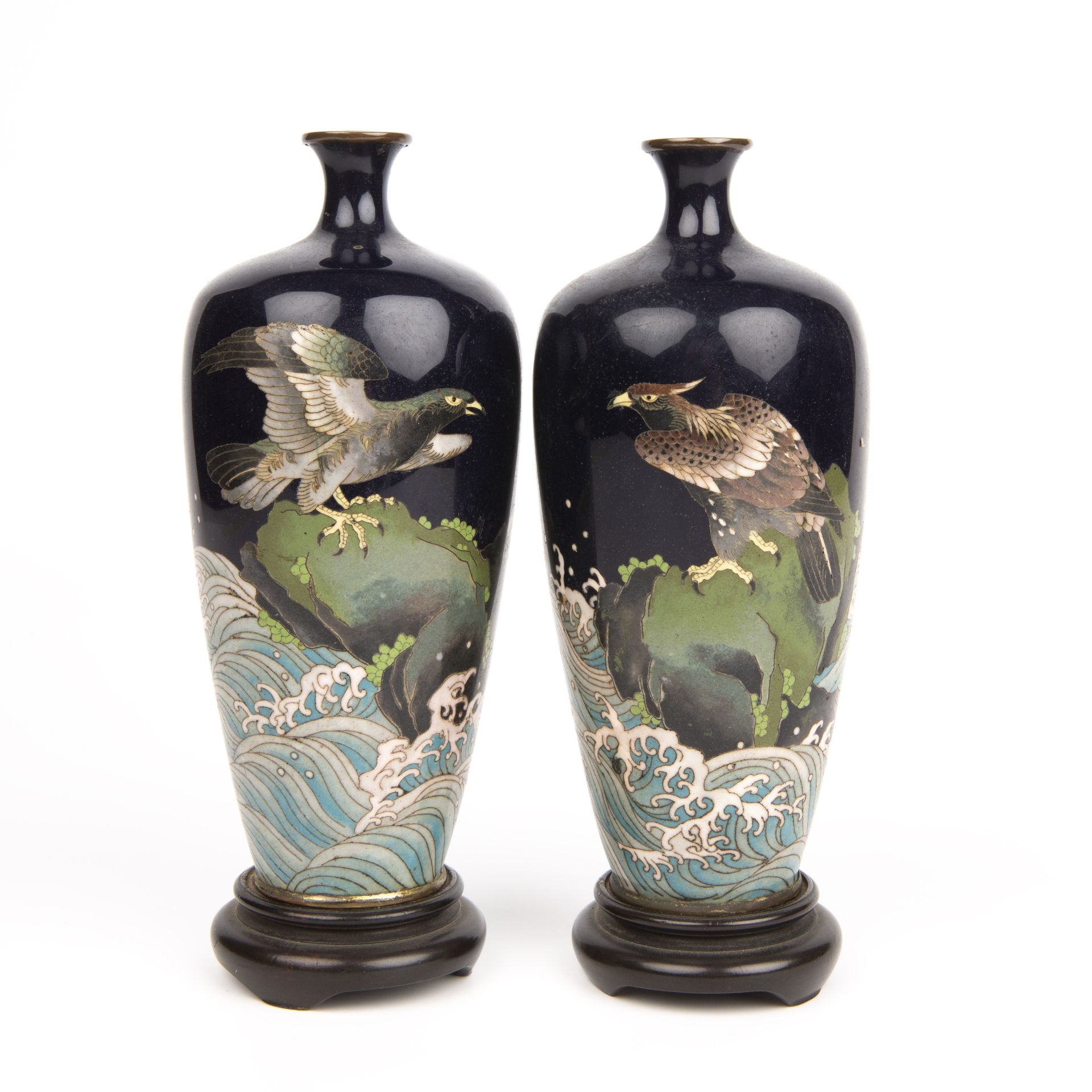 A small pair of early 20th century Japanese cloisonne vases decorated with eagles each 15cm high.