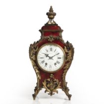 A late 19th century tortoiseshell mantle clock, the white enamel Roman dial with Arabic five minutes