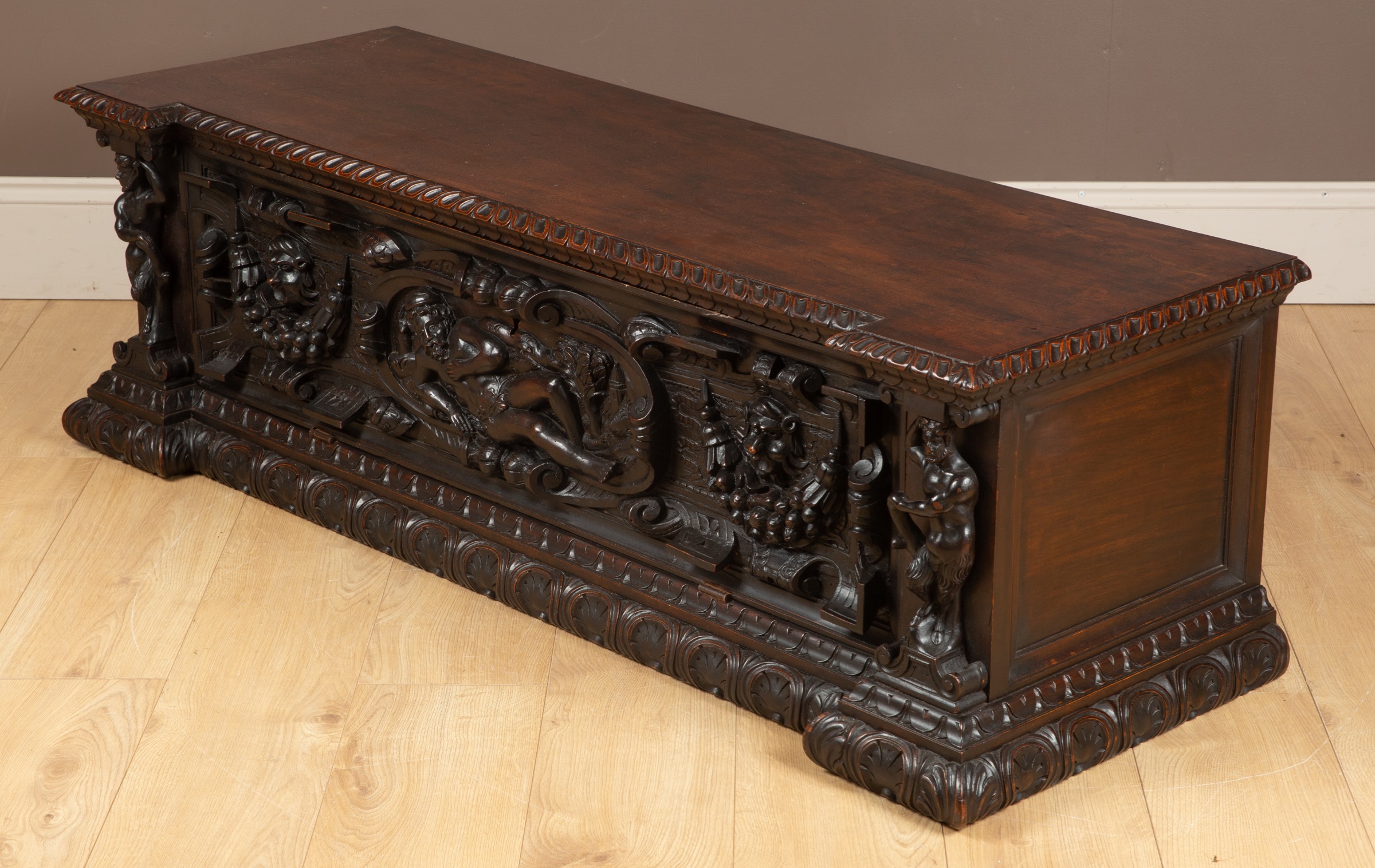 An Italian walnut cassone with a figurally carved fall front. 145cm wide x 51cm deep x 45cm high - Image 2 of 32