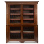 A Regency mahogany brass inlaid bookcase with adjustable shelves and wirework doors, all raised on