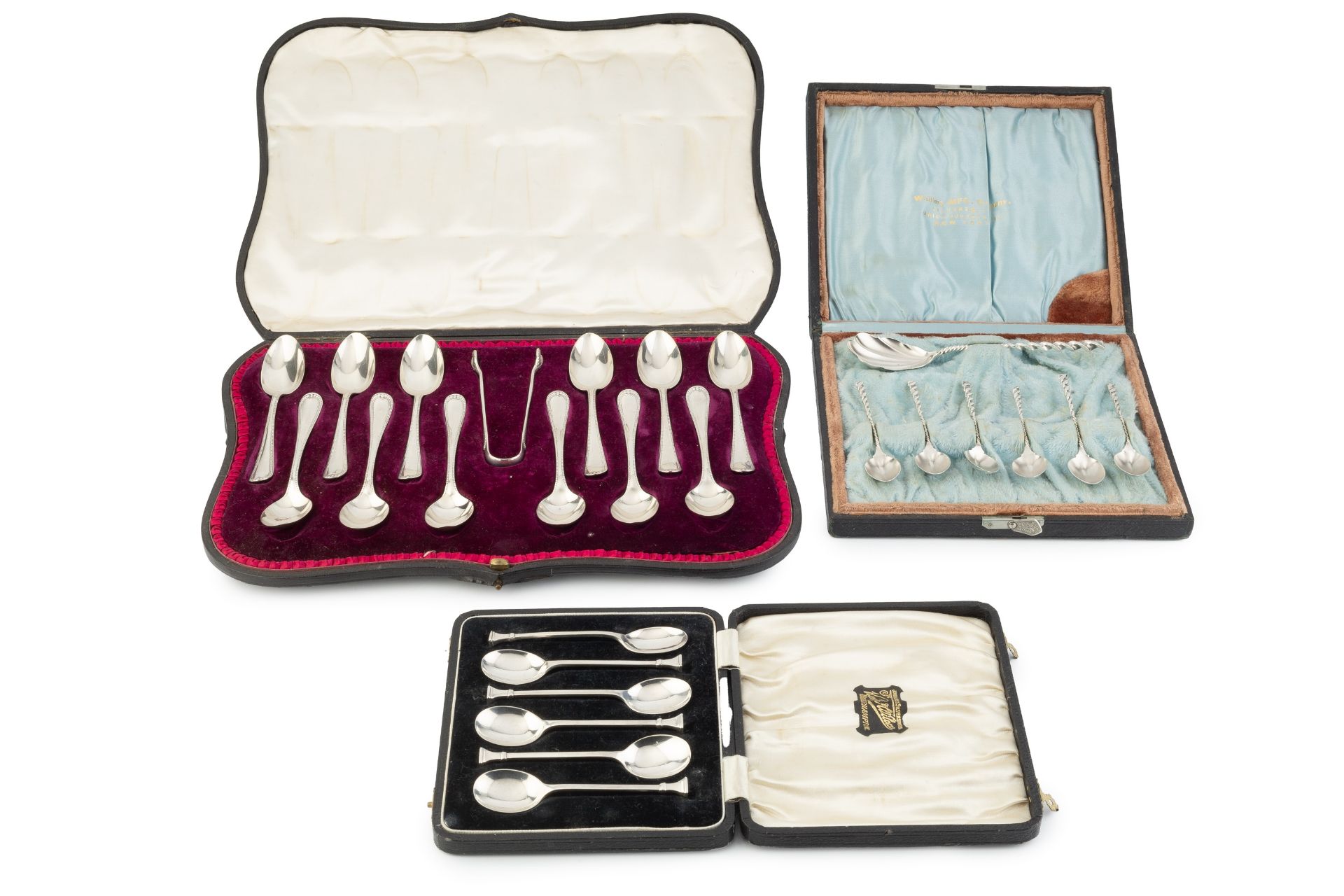 A set of twelve Edwardian silver teaspoons, with matching sugar tongs, Having beaded borders, import