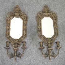 A pair of 19th century ornate brass girandole, of Renaissance style, surmounted by masks, with three