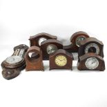 A collection of early 20th century mahogany cased mantel clocks and clock cases, together with a