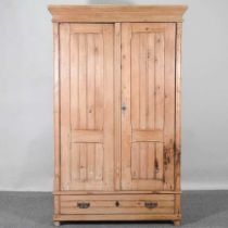 An early 20th century continental pine wardrobe, with a drawer below 106w x 51d x 173h cm