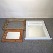 A painted wall mirror, 91 x 70cm, together with another, a wall clock and a gilt picture frame, 62 x
