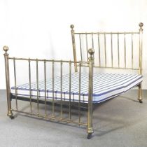 An early 20th century brass bed, with a sprung base 202w x 140d x 142h cm
