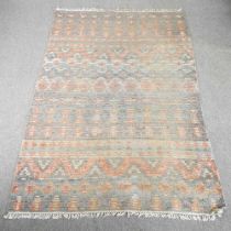 A woollen carpet, with all over geometric designs, 254 x 173cm