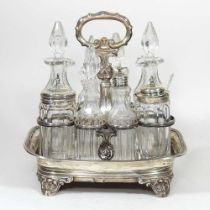 A George II silver cruet stand, containing a collection of eight various cut glass and silver